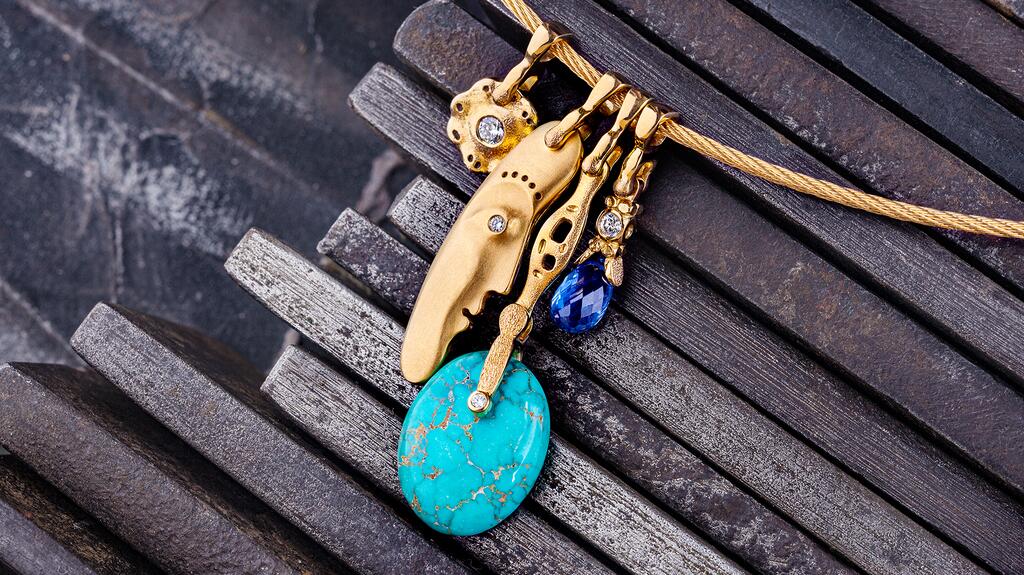 A collection of charms from Alex Šepkus. Rosenheim said the late artist’s work appeals to curious minds; he described it as “the thinking man’s jewelry.” (Photo courtesy of Alex Šepkus Co.) 20210910_Alex Sepkus charms.jpg